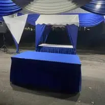 Blue skirt counter table under canopy
