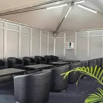 Black lounge sofa setup inside canopy