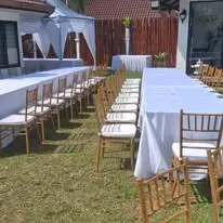 Garden long table setup with Chiavari chairs