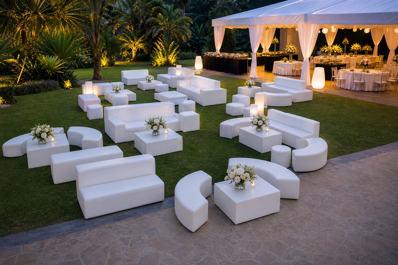 Outdoor white modular sofa lounge sets arranged on garden lawn beside event canopy