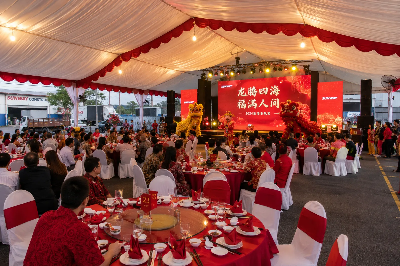 Red theme canopy dinner with round tables and covered banquet chairs