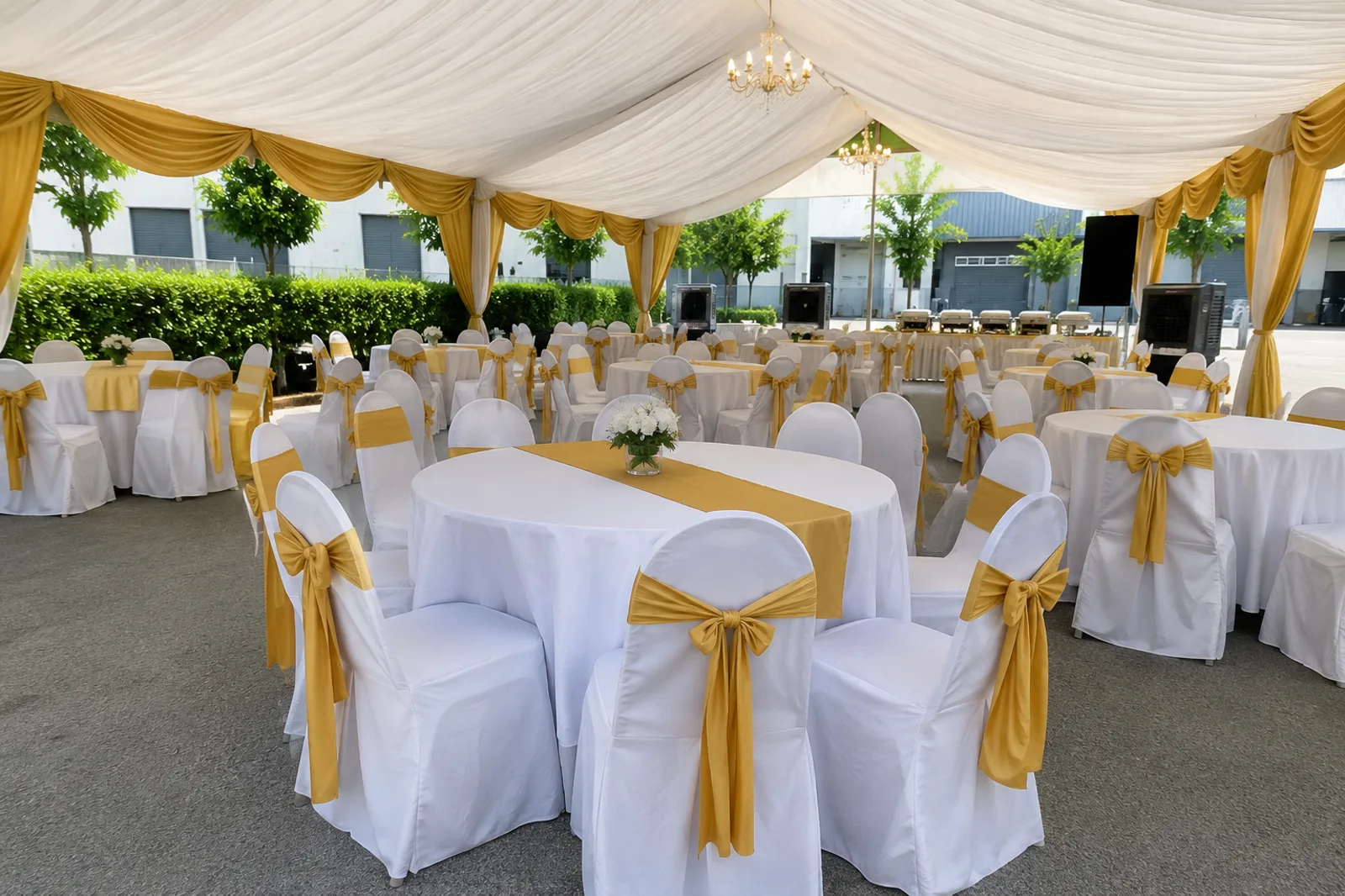 Canopy round table setup with gold drape, white covers and banquet chairs